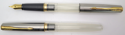 ITEM # 6691: FRONTIER SHOP PROTOTYPE FOUNTAIN PEN IN CLEAR PLASTIC WITH BRUSHED STAINLESS CAP AND GOLD PLATED TRIM. CARTRIDGE FILLER. NIB IS MEDIUM. 